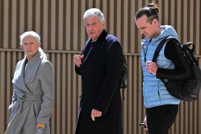 (FILES) Jean (C) and Viviane (L) Badache, owners of Apollonia, flanked of their son Benjamin Heysen-Badache arrive at courthouse in Marseille on 1 April, 2025. The Apollonia case, a real estate fraud of nearly one billion euros, has been on trial since March 31, in Marseille for more than two months, with hundreds of victims who hoped to build up wealth at low cost. (Photo by Christophe SIMON / AFP) / The erroneous mention[s] appearing in the metadata of this photo by Christophe SIMON has been modified in AFP systems in the following manner: [Apollonia] instead of [Apolonia]. Please immediately remove the erroneous mention[s] from all your online services and delete it (them) from your servers. If you have been authorized by AFP to distribute it (them) to third parties, please ensure that the same actions are carried out by them. Failure to promptly comply with these instructions will entail liability on your part for any continued or post notification usage. Therefore we thank you very much for all your attention and prompt action. We are sorry for the inconvenience this notification may cause and remain at your disposal for any further information you may require.