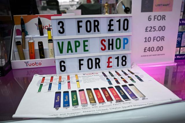 (FILES) A photograph taken on April 10, 2024 shows a stand selling vapes also called electronic cigarettes or e-cigarettes in a shop in Liverpool. A ban on disposable vapes goes into effect across the UK on June 1, 2025, in a bid to protect children's health and tackle a "throwaway" culture. (Photo by Paul ELLIS / AFP)