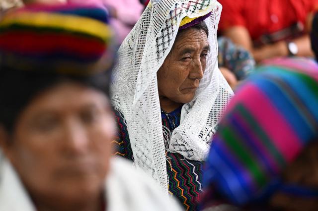 EDITORS NOTE: Graphic content / Guatemalan Achi women -victims of rape during the civil war- react at the end of the trial against three former paramilitaries, who were sentenced to 40 years in prison for crimes of sexual violence against six Mayan women from the Achi community of Rabinal during the civil war in Guatemala (1960-1996), at the Palace of Justice in Guatemala City on May 30, 2025. The three former paramilitaries, also indigenous, were members of the Civil Self-Defense Patrols, created by the Armed Forces to fight the leftist guerrillas during the war that left 200,000 dead and missing, according to the UN. (Photo by JOHAN ORDONEZ / AFP)