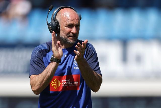 Castres' French coach Xavier Sadourny applauds prior to the French Top 14 rugby union match between Castres Olympique and Aviron Bayonnais (Bayonne) at the Stade Pierre-Fabre in Castres, southern France on May 31, 2025. (Photo by Valentine CHAPUIS / AFP)