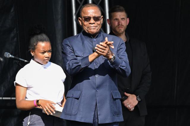 Cameroonian leader of the main opposition Movement for the Renaissance of Cameroon (MRC) and presidential candidate Maurice Kamto arrives on stage for a speech before thousands of people gathered for a political meeting six months ahead of the presidential election in Cameroon, on the Place de la Republique square in Paris on May 31, 2025. (Photo by Hugo MATHY / AFP)