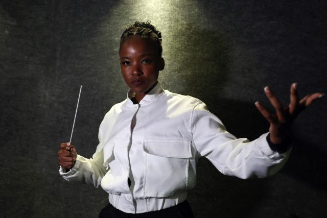 (FILES) South African conductor Ofentse Pitse poses for a photograph during rehearsals at Marks Park Sports Club in Johannesburg on June 4, 2024 as they prepare for a show that brings together classical music and popular South African genre, Amapiano. (Photo by Phill Magakoe / AFP)