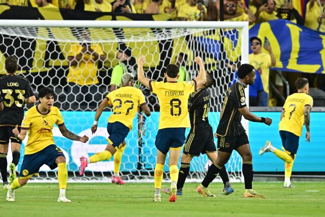Club America's Uruguayan midfielder #07 Brian Rodriguez (R) celebrates scoring his team's first goal from the penalty spot during a play-in match between LAFC and Club America for the final spot in the 2025 FIFA Club World Cup, at BMO Stadium in Los Angeles, California, on May 31, 2025. (Photo by Frederic J. BROWN / AFP)