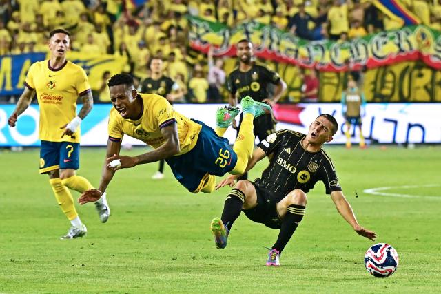 Club America's Colombian defender #26 Cristian Borja fights for the ball with LAFC's Spainish defender #14 Sergi Palencia during a play-in match between LAFC and Club America for the final spot in the 2025 FIFA Club World Cup, at BMO Stadium in Los Angeles, California, on May 31, 2025. (Photo by Frederic J. BROWN / AFP)