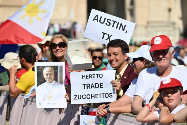 People attend the mass celebrated by Pope Leo IV for the Jubilee of families, children, grandparents and the elderly, at St. Peter's square in the Vatican on June 1, 2025. (Photo by Alberto PIZZOLI / AFP)