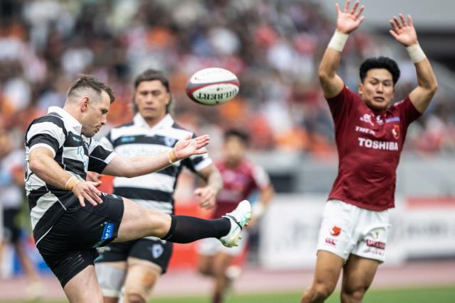 Kubota Spears Funabashi Tokyo Bay's Bernard Foley kicks the ball during the Rugby League One 2024-25 play-offs final between Toshiba Brave Lupus Tokyo and Kubota Spears Funabashi Tokyo Bay at the National Stadium in Tokyo on June 1, 2025. (Photo by Philip FONG / AFP)