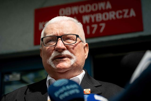 Former president of Poland Lech Walesa speaks to the media outside a polling station in Gdansk, Poland, during the second round of the presidential elections on June 1, 2025. Polling stations opened for a tight presidential election runoff that will have major implications for the country's role in Europe, and for abortion and LGBTQ rights. Opinion polls have predicted an extremely close race with nationalist historian Karol Nawrocki and pro-EU Warsaw Mayor Rafal Trzaskowski neck and neck ahead of the vote. (Photo by MATEUSZ SLODKOWSKI / AFP)
