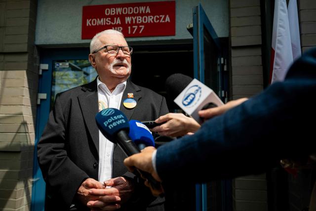 Former president of Poland Lech Walesa speaks to the media outside a polling station in Gdansk, Poland, during the second round of the presidential elections on June 1, 2025. Polling stations opened for a tight presidential election runoff that will have major implications for the country's role in Europe, and for abortion and LGBTQ rights. Opinion polls have predicted an extremely close race with nationalist historian Karol Nawrocki and pro-EU Warsaw Mayor Rafal Trzaskowski neck and neck ahead of the vote. (Photo by MATEUSZ SLODKOWSKI / AFP)