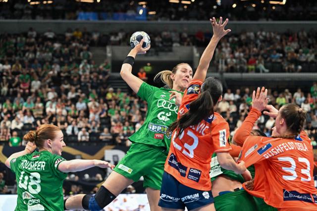 Gyor's Norwegian left back Kristine Breistol (2L) and Gyor's Dutch right back Dione Housheer (L) vie for the ball with Odense's Danish left wing Elma Halilcevic and Odense's Norwegian centre back Thale Rushfeldt Deila during the EHF FINAL4 Women 2025 Champions League final handball match between Gyori Audi ETO KC (HUN) and Odense Handbold (DEN) on June 1, 2025 in Budapest, Hungary. (Photo by Attila KISBENEDEK / AFP)