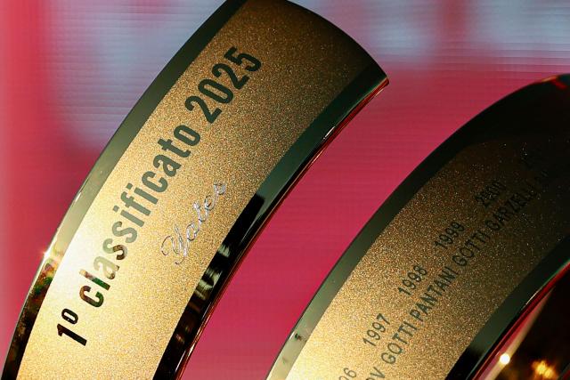 This photograph shows the Trofeo Senza Fine reading "1 classificato 2025, Yates" displayed at the end of the 21st and last stage of the 108th Giro d'Italia cycling race of 143kms from Rome to Rome on June 1, 2025. (Photo by Luca Bettini / AFP)