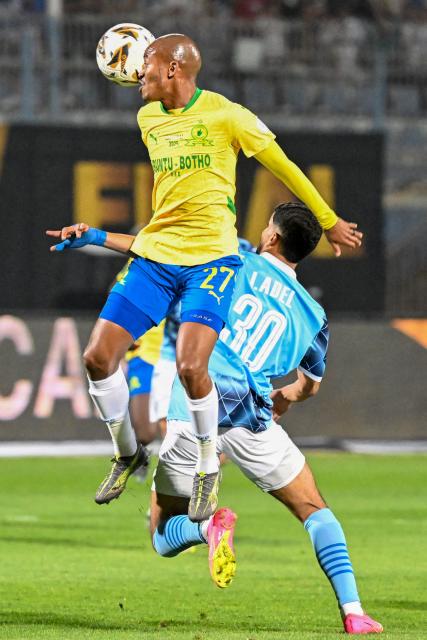 Sundowns' South African defender #27 Thapelo Morena vies for the ball with Pyramids' Egyptian forward #30 Ibrahim Adel during the second leg of the CAF Champions League final football match between Pyramids FC and Mamelodi Sundowns at 30 June Stadium in Cairo on June 1, 2025. (Photo by Khaled DESOUKI / AFP)