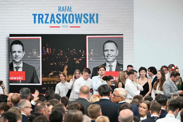 Supporters of Rafal Trzaskowski, Warsaw's Mayor and member of ruling centrist Civic Coalition party, attend their election night event at the the National Museum of Ethnography in Warsaw, Poland, during the second round of the presidential elections on June 1, 2025. Poles voted in a tight presidential election runoff that will have major implications for the country's role in Europe, and for abortion and LGBTQ rights. Opinion polls have predicted an extremely close race with nationalist historian Karol Nawrocki and pro-EU Warsaw Mayor Rafal Trzaskowski neck and neck ahead of the vote. (Photo by Sergei GAPON / AFP)