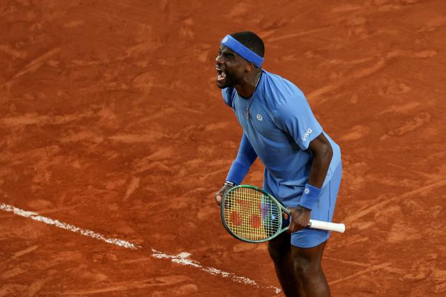 US Frances Tiafoe celebrates after winning his men's singles match against Germany's Daniel Altmaier on day 8 of the French Open tennis tournament on Court Suzanne-Lenglen at the Roland-Garros Complex in Paris on June 1, 2025. (Photo by Alain JOCARD / AFP)