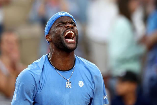 US Frances Tiafoe celebrates after winning his men's singles match against Germany's Daniel Altmaier on day 8 of the French Open tennis tournament on Court Suzanne-Lenglen at the Roland-Garros Complex in Paris on June 1, 2025. (Photo by Anne-Christine POUJOULAT / AFP)