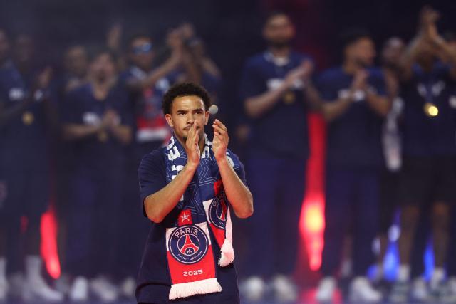 Paris Saint-Germain's French midfielder #33 Warren Zaire-Emery arrives on the pitch during a ceremony to present the trophy a day after Paris Saint-Germain (PSG) football club won the UEFA Champions League, at the Parc des Princes Stadium in Paris on June 1, 2025. (Photo by FRANCK FIFE / AFP)