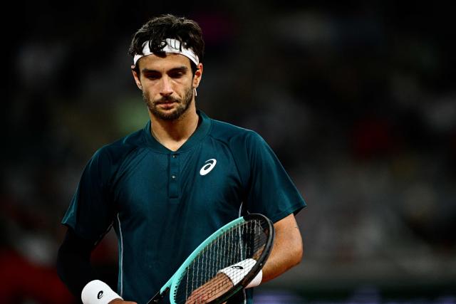 Italy's Lorenzo Musetti reacts during his men's singles match against Denmark's Holger Rune on day 8 of the French Open tennis tournament on Court Philippe-Chatrier at the Roland-Garros Complex in Paris on June 1, 2025. (Photo by JULIEN DE ROSA / AFP)