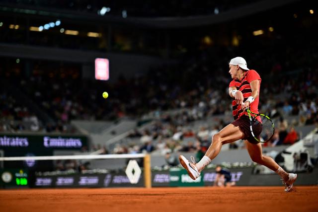 Denmark's Holger Rune plays a backhand return to Italy's Lorenzo Musetti during their men's singles match on day 8 of the French Open tennis tournament on Court Philippe-Chatrier at the Roland-Garros Complex in Paris on June 1, 2025. (Photo by JULIEN DE ROSA / AFP)