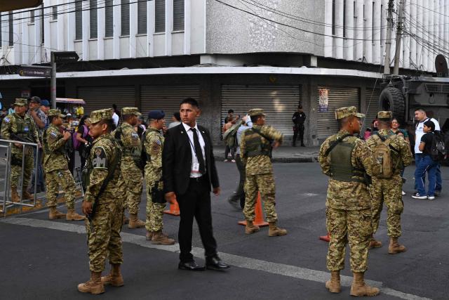 Army soldiers secure the area before El Salvador's President Nayib Bukele delivers his first-year speech outside the National Theatre in San Salvador on June 1, 2025. (Photo by Marvin RECINOS / AFP)