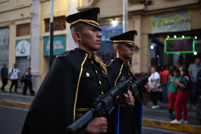 Members of the Presidential Guard secure the area before El Salvador's President Nayib Bukele delivers his first-year speech outside the National Theatre in San Salvador on June 1, 2025. (Photo by Marvin RECINOS / AFP)