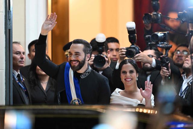 El Salvador's President Nayib Bukele and his wife Gabriela Rodriguez leave the National Theatre after deliver his first-year speech in San Salvador on June 1, 2025. (Photo by Marvin RECINOS / AFP)