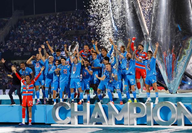 Cruz Azul's Uruguayan midfielder #15 Ignacio Rivero lifts the trophy next to teammates after winning the CONCACAF Champions Cup final football match between Mexico's Cruz Azul and Canada's Vancouver Whitecaps at the Olimpico Universitario Stadium in Mexico City on June 1, 2025. (Photo by DANIEL GAMEZ GUTIERREZ / AFP)
