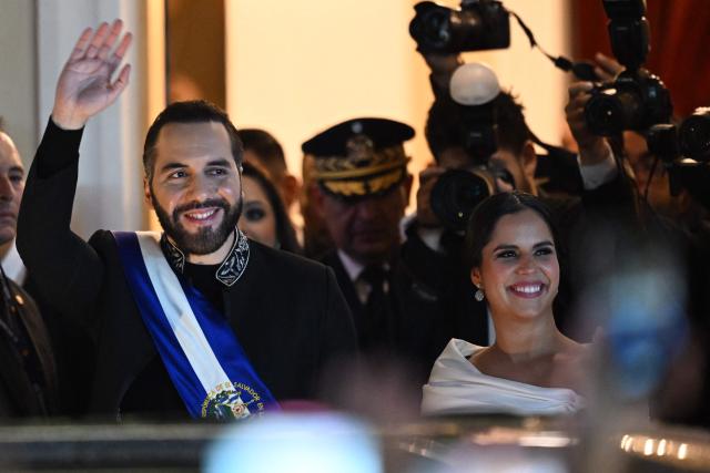 El Salvador's President Nayib Bukele and his wife Gabriela Rodriguez leave the National Theatre after deliver his first-year speech in San Salvador on June 1, 2025. (Photo by Marvin RECINOS / AFP)