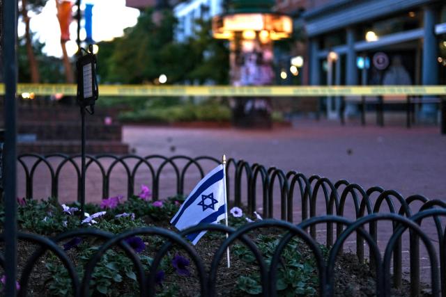 An Israeli flag stands in a bed of flowers as caution tape blocks off a deserted Pearl Street on the scene of an attack on demonstrators calling for the release of Israeli hostages held in Gaza, in Boulder, Colorado, on June 1, 2025. Several people suffered burns and other injuries June 1st in the US state of Colorado in what the FBI called a "targeted terror attack" against demonstrators seeking the release of Israeli hostages held in Gaza.
Police in the city of Boulder said a man was taken into custody. They were more cautious in presuming a possible motive for the attack, which multiple sources said was committed against members of the Jewish community during a peaceful gathering. (Photo by Eli Imadali / AFP)