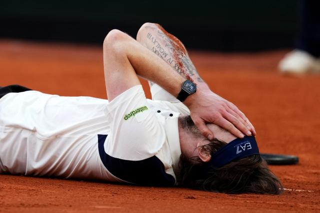 Kazakhstan's Alexander Bublik celebrates after winning his men's singles match against Britain's Jack Draper on day 9 of the French Open tennis tournament on Court Suzanne-Lenglen at the Roland-Garros Complex in Paris on June 2, 2025. (Photo by Dimitar DILKOFF / AFP)