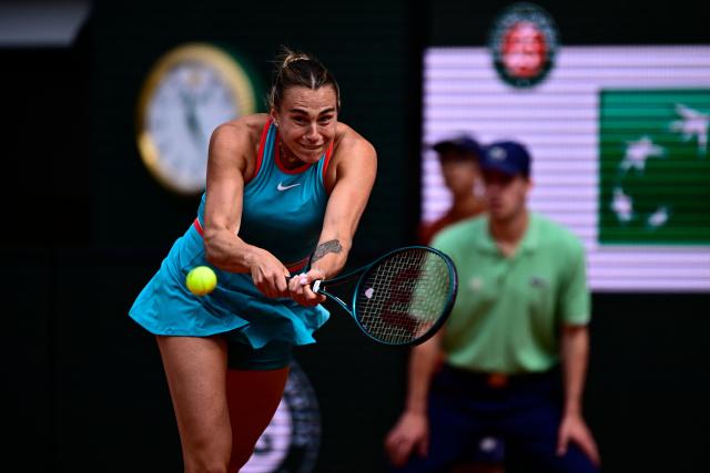 Belarus' Aryna Sabalenka plays a backhand return to China's Zheng Qinwen during their quarter-final women's singles match on day 10 of the French Open tennis tournament on Court Philippe-Chatrier at the Roland-Garros Complex in Paris on June 3, 2025. (Photo by JULIEN DE ROSA / AFP)
