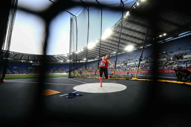 China's Feng Bin competes in the women's discus throw event of the Diamond League athletics meeting at the Olympic stadium in Rome on June 6, 2025. (Photo by Filippo MONTEFORTE / AFP)