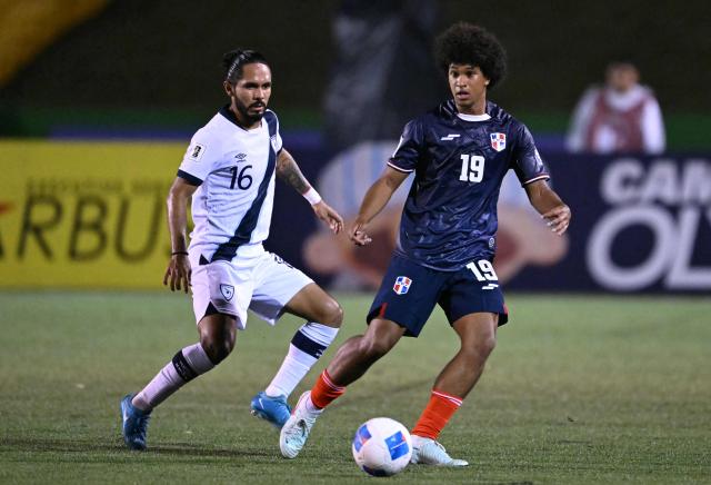 Guatemala's defender #16 Jose Morales and Dominican forward #19 Peter Gonzalez fight for the ball during the 2026 FIFA World Cup Concacaf qualifier football match between Guatemala and Dominican Republic at the Cementos Progreso stadium in Guatemala city on June 6, 2025. (Photo by JOHAN ORDONEZ / AFP)