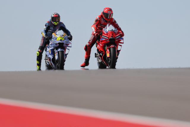 Ducati Lenovo Team's Spanish rider Marc Marquez (R) and Gresini Racing MotoGP's Spanish rider Fermin Aldeguer ride during the free practice session of the MotoGP Aragon Grand Prix at the Motorland circuit in Alcaniz, northeastern Spain, on June 7, 2025. (Photo by LLUIS GENE / AFP)