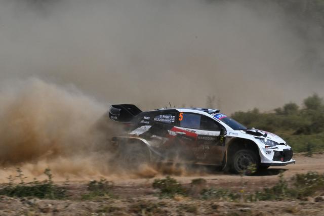 Finland's Sami Pajari and his co-driver Findland's Marko Salminen drive their Toyota GR Yaris Rally 1 as they compete in the SS7 special between Ciluna and Loelle during the 22nd edition of the Rally Italia Sardegna, 6th round of the FIA World Rally Championship (WRC), near Budusso, Sardinia, on June 7, 2025. (Photo by Andreas SOLARO / AFP)