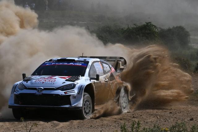 Finland's Sami Pajari and his co-driver Findland's Marko Salminen drive their Toyota GR Yaris Rally 1 as they compete in the SS7 special between Ciluna and Loelle during the 22nd edition of the Rally Italia Sardegna, 6th round of the FIA World Rally Championship (WRC), near Budusso, Sardinia, on June 7, 2025. (Photo by Andreas SOLARO / AFP)