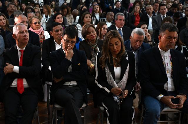 Lawmakers attend a mass to pray for the health of Colombian senator and presidential candidate Miguel Uribe at the Congress in Bogota on June 9, 2025. Doctors treating a Colombian presidential hopeful shot twice in the head by a would-be assassin warned he was not responding well to treatment Monday and that his condition remained grave. Right-wing Senator Miguel Uribe, 39, was shot by a 15-year-old alleged hitman at close range while campaigning in Bogota on Saturday. (Photo by Raul ARBOLEDA / AFP)