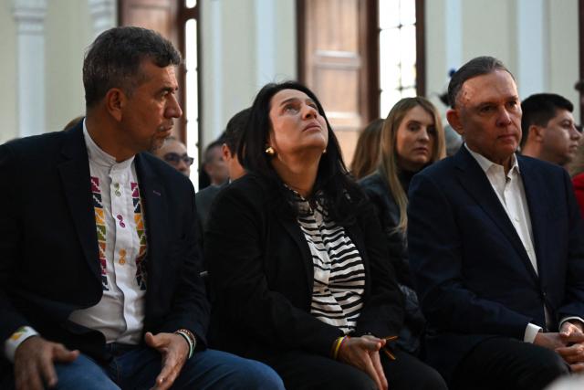 Lawmakers attend a mass to pray for the health of Colombian senator and presidential candidate Miguel Uribe at the Congress in Bogota on June 9, 2025. Doctors treating a Colombian presidential hopeful shot twice in the head by a would-be assassin warned he was not responding well to treatment Monday and that his condition remained grave. Right-wing Senator Miguel Uribe, 39, was shot by a 15-year-old alleged hitman at close range while campaigning in Bogota on Saturday. (Photo by Raul ARBOLEDA / AFP)