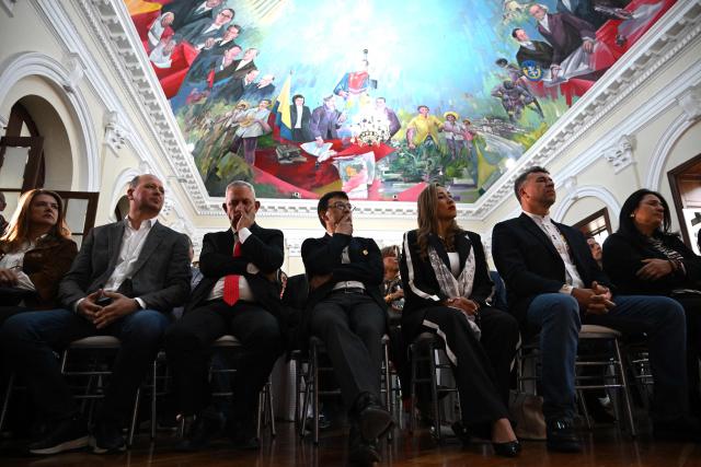 Lawmakers attend a mass to pray for the health of Colombian senator and presidential candidate Miguel Uribe at the Congress in Bogota on June 9, 2025. Doctors treating a Colombian presidential hopeful shot twice in the head by a would-be assassin warned he was not responding well to treatment Monday and that his condition remained grave. Right-wing Senator Miguel Uribe, 39, was shot by a 15-year-old alleged hitman at close range while campaigning in Bogota on Saturday. (Photo by Raul ARBOLEDA / AFP)