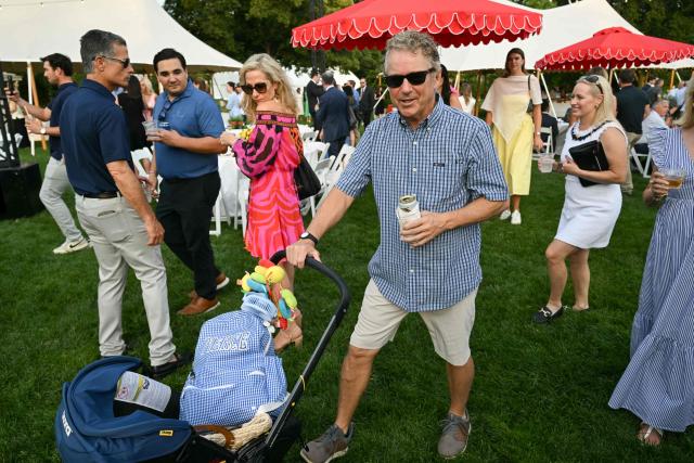 US Senator Rand Paul (R-KY) pushes a stroller as he attends the Congressional Picnic on the South Lawn of the White House in Washington, DC, on June 12, 2025. (Photo by SAUL LOEB / AFP)