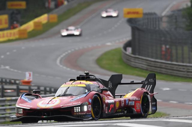 Ferrari AF Corse's Italian driver #50 Antonio Fuoco steers his hypercar during the 2025 Le Mans 24 hour endurance race, at the Le Mans circuit, in north-western France on June 14, 2025. (Photo by JEAN-FRANCOIS MONIER / AFP)