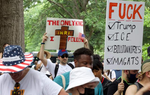 Protesters rally at Lafayette Square during the "No Kings" protest in Washington, DC, on June 14, 2025, the day of President Trump's military parade. In response to the military parade celebrating the 250th anniversary of the US Army but also coinciding with Trump's 79th birthday, a "No Kings" movement has sprung up promising to stage protests in more than 2,000 places across the country, including a large parade expected in Los Angeles which organizers say will feature a "20-foot-tall balloon of Trump wearing a diaper." (Photo by Amid FARAHI / AFP)