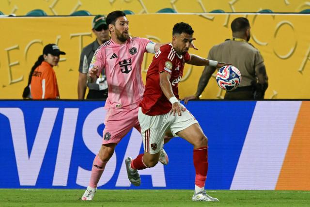 Inter Miami's Argentine forward #10 Lionel Messi and Al Ahly's Egyptian midfielder #07 Trezeguet fight for the ball during the Club World Cup 2025 Group A football match between Egypt's Al-Ahly and US Inter Miami at the Hard Rock stadium in Miami on June 14, 2025. (Photo by CHANDAN KHANNA / AFP)