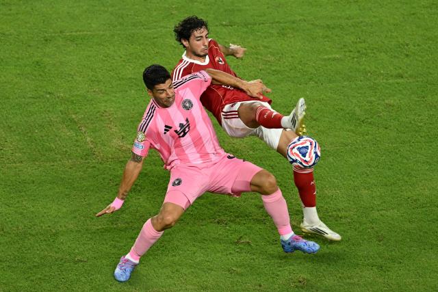 Inter Miami's Uruguayan forward #09 Luis Suarez and Al Ahly's Egyptian defender #30 Mohamed Hany fight for the ball during the Club World Cup 2025 Group A football match between Egypt's Al-Ahly and US Inter Miami at the Hard Rock stadium in Miami on June 14, 2025. (Photo by ROBERTO SCHMIDT / AFP)