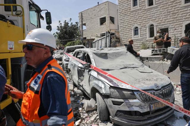 A member of the search and rescue teams works in a neighbourhood in the northern Israeli village of Tamra, following an overnigh missile attack from Iran on June 15, 2025, where four people, including a child, were reported killed. Iranian missile fire on Israel killed at least 10 people overnight, authorities said on June 15, as the foes exchanged new waves of attacks in their most intense confrontation in history. (Photo by AHMAD GHARABLI / AFP)