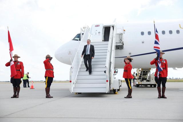 Britain's Prime Minister Keir Starmer disembarks at Calgary International Airport, before the start of the G7 summit, in Calgary, Alberta, Canada, June 15, 2025 (Photo by Suzanne Plunkett / REUTERS / AFP)