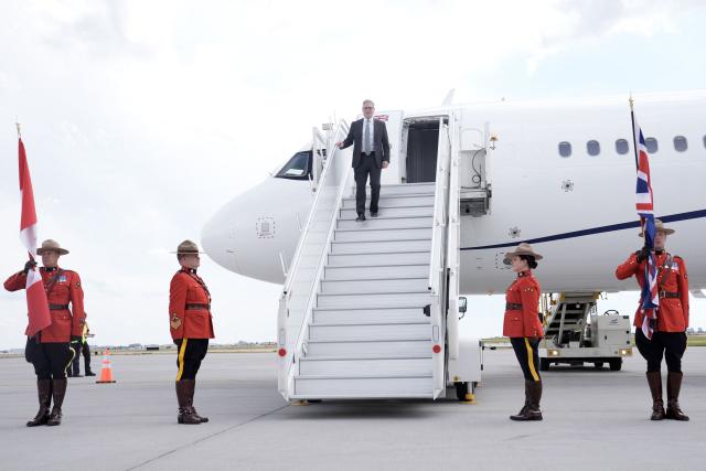 British Prime Minister Keir Starmer steps off the plane upon arrival at Calgary International Airport, before the start of the G7 summit, in Calgary, Alberta, Canada, June 15, 2025 (Photo by Stefan Rousseau / POOL / AFP)