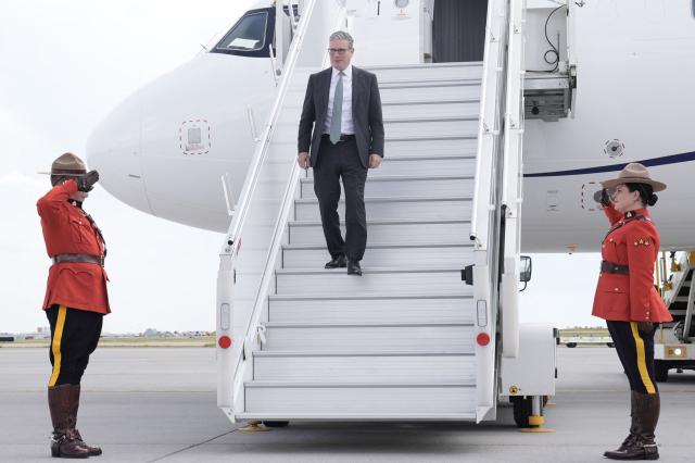 British Prime Minister Keir Starmer steps off the plane upon arrival at Calgary International Airport, before the start of the G7 summit, in Calgary, Alberta, Canada, June 15, 2025 (Photo by Stefan Rousseau / POOL / AFP)