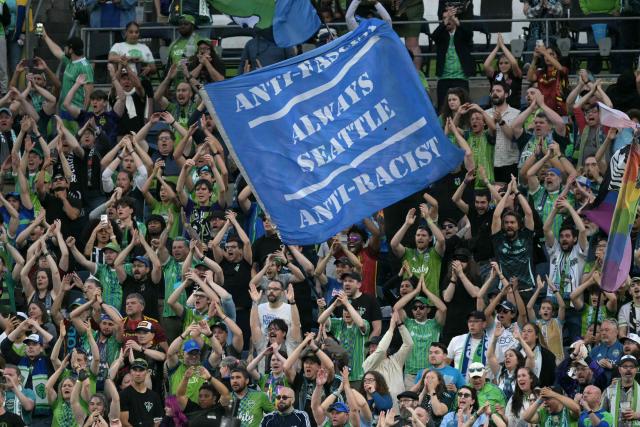 Fans of Seattle Sounders cheer for their team during the Club World Cup 2025 Group B football match between Brazil's Botafogo and US Seattle Sounders at the Lumen Field stadium in Seattle on June 15, 2025. (Photo by JUAN MABROMATA / AFP)