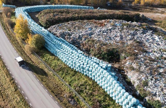 (FILES) The so-called "Skultunatippen" ("the Skultuna dump") is pictured on October 18, 2023 in Skultuna, one of the several places in central Sweden that the company "NMT Think Pink" has turned into a garbage dump. A court in Sweden will rule on June 17, 2025 in the country's biggest environmental crime trial, where a self-proclaimed "Queen of Trash" and four others stand accused of illegally dumping toxic waste. The once-acclaimed waste management company Think Pink is accused of dumping or burying some 200,000 tonnes of waste from the Stockholm area at 21 sites from 2015 to 2020, with no intention of processing it correctly. (Photo by Fredrik SANDBERG / TT News Agency / AFP) / Sweden OUT