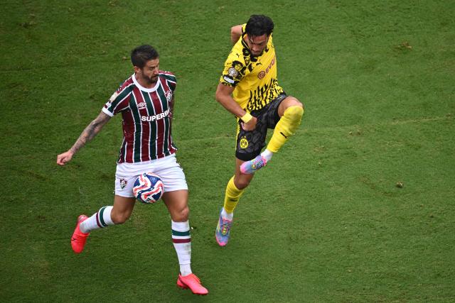 Fluminense's Brazilian forward #09 Everaldo and Borussia Dortmund's Algerian defender #05 Ramy Bensebaini vie for the ball during the FIFA Club World Cup 2025 Group F football match between Brazil's Fluminense and Germany's Borussia Dortmund at the MetLife stadium in East Rutherford, New Jersey on June 17, 2025. (Photo by ANGELA WEISS / AFP)