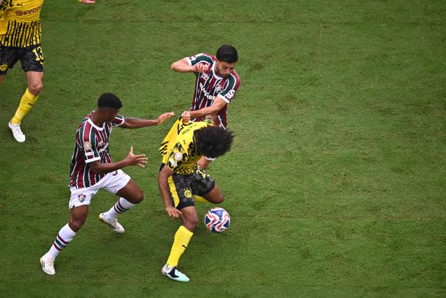 Borussia Dortmund's German forward #27 Karim Adeyemi vies for the ball with Fluminense's Brazilian midfielder #35 Hercules and Fluminense's Brazilian midfielder #16 Nonato during the FIFA Club World Cup 2025 Group F football match between Brazil's Fluminense and Germany's Borussia Dortmund at the MetLife stadium in East Rutherford, New Jersey on June 17, 2025. (Photo by ANGELA WEISS / AFP)